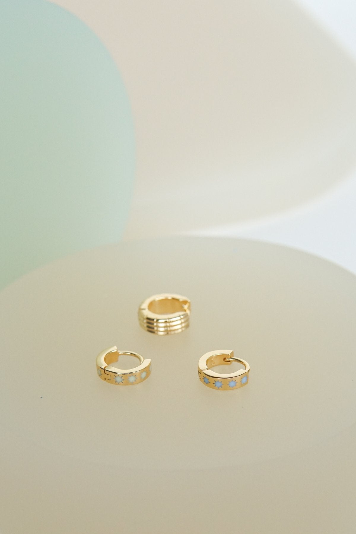 Blue sky star huggie gold plated-abc